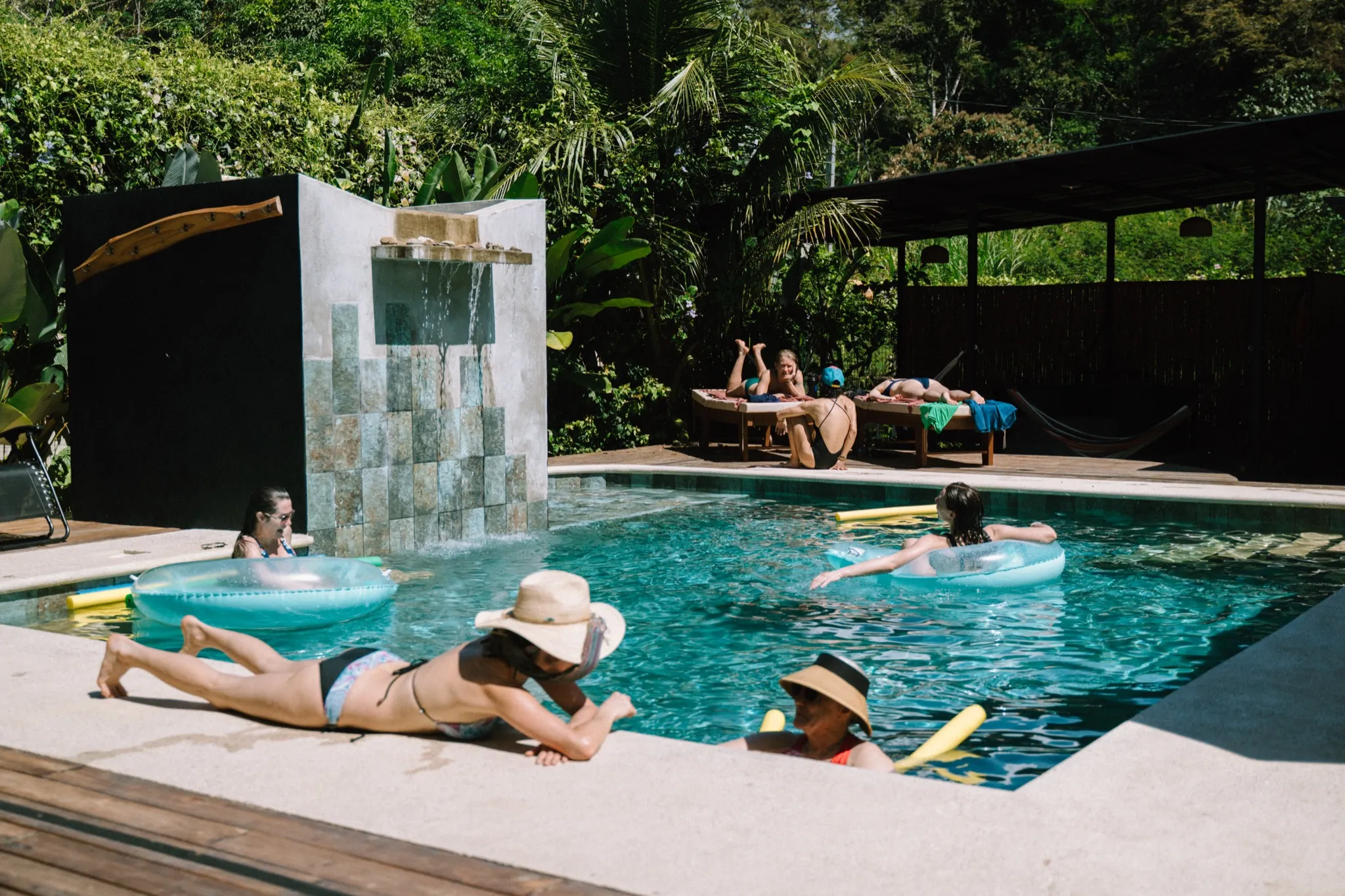 people lounging around the pool
